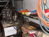 a lot of wires and other items on the shelves