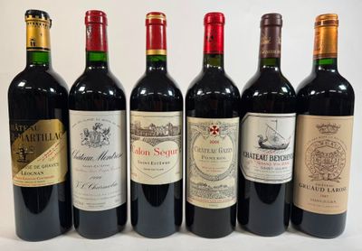 six bottles of wine are lined up in a row on a white surface