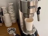 a coffee maker sitting on top of a wooden table