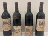 trois bouteilles de vin sont alignées sur une surface blanche
