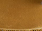 the back of a chair with a brown upholstered seat