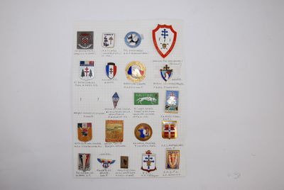 a picture of a wall with a bunch of badges on it