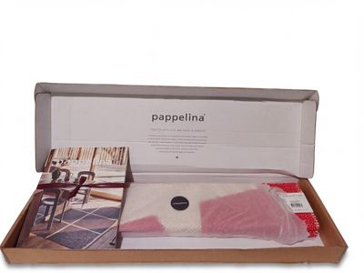 the box is full of items that are sitting on the floor