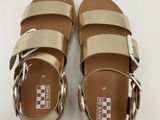 a close up of a pair of sandals on a white surface
