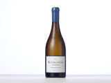 a bottle of white wine sitting on top of a table