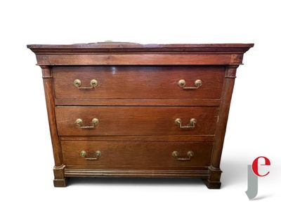 a wooden chest of drawers with brass hardware on it