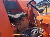 a tractor that is sitting in the dirt