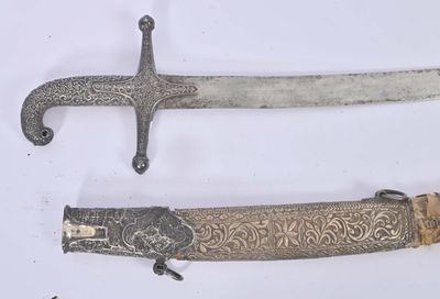 three different types of swords are displayed on a white surface