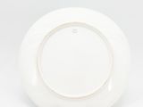 an image of a white plate on a stand on a white background