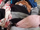 a suitcase full of clothes sitting on the floor