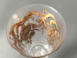 a glass bowl with a gold design on it