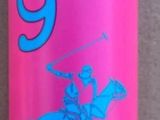 a pink bottle with a blue lid sitting on a tiled floor