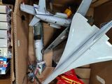 a cardboard box with a model airplane in it
