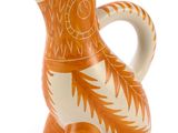 un vase orange et blanc orné d'un motif