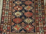 a rug with a blue and red design on it
