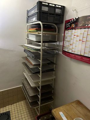 a room with a bunch of shelves and a table