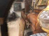a horse drawn carriage in the reflection of a mirror
