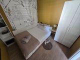 a bedroom with a bed and a closet in it