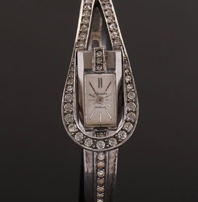 an art deco ladies ' s watch with diamonds set in a tear shape