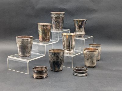 many cups that are sitting on a clear stand