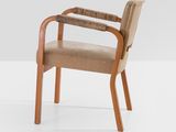 the chair is made of wood and has a beige seat