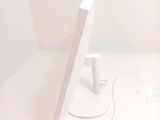 a computer monitor sitting on top of a white desk
