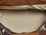 a close up of a brown bag with a handle