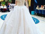 a woman in a wedding dress holding a sign