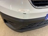 the front bumper of a white car with a sticker on it ' s bumper