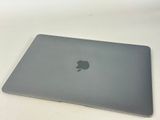 an apple macbook pro laptop sitting on top of a white table