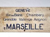 a sign on the side of a building that says marseille