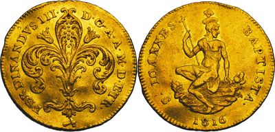 a gold coin with a woman sitting on top of it