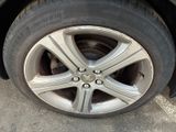 a close up of a tire on a car ' s rim