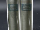 pair of two books sitting on top of each other on a table
