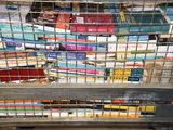 many books in a metal cage on a shelf