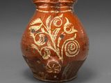 an image of a vase with a design on it