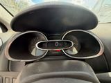 a car dashboard with a dash light and a steering control