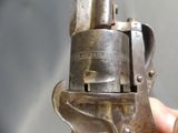 a person holding a gun in their hand