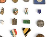 a lot of medals and medals on a white surface