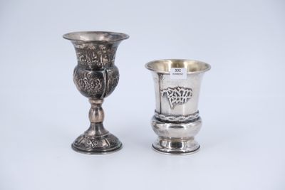 pair of silver goblets on a white surface with a white background