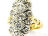 an image of a gold and silver ring with diamonds on it