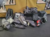 a pile of luggage sitting on the floor next to a tent