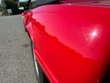 a red car parked on the side of the road