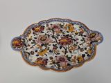 a plate with flowers on it sitting on a table