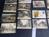many old postcards on display on a table