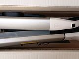 two hair dryers sitting in a box on a table