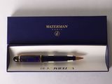 the pen is in a blue box on a white surface