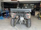 an image of a large atv in a garage