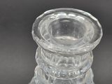 a clear glass vase with a clear top on a table