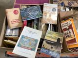 a box full of books that are sitting on the floor